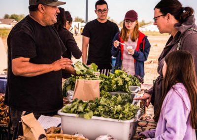 Farmers Market visitors gather for samples and produce